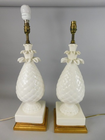 A pair of large cream glazed pottery table lamps