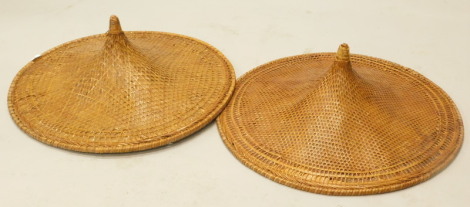 A pair of old oriental bamboo coolie hats