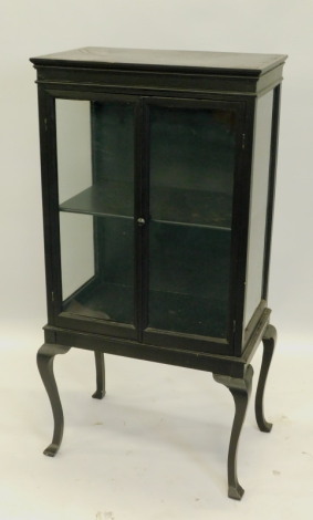 An ebonised display cabinet