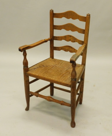 A 19thC country made ash ladderback open armchair