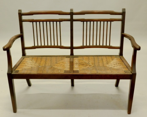 An Edwardian mahogany chair back sofa