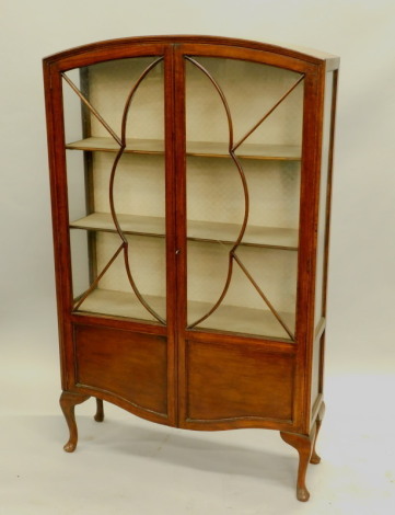 A mid 20thC oak display cabinet