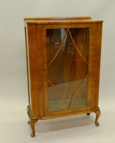 A walnut display cabinet