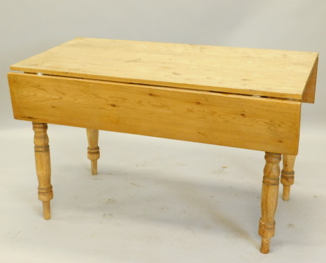 A Victorian style pine drop leaf kitchen table