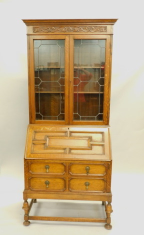 An early 20thC oak bureau bookcase