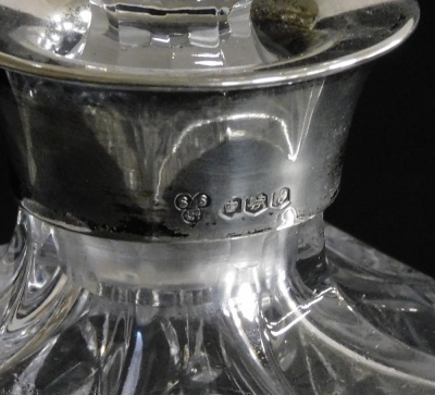 An Elizabeth II cut glass and silver mounted decanter, Sterling Silverware Ltd, Sheffield 1972, 26cm high. - 2