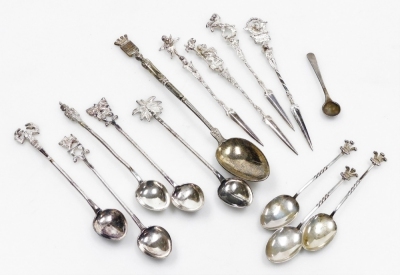 A group of small silver and white metal flatware, to include four Italian white metal cocktail picks, with cast metal terminals of an eagle, cupid, lion and prancing horse, two white metal coffee spoons with lobster and palm tree terminal, etc., 4.66oz al