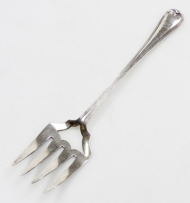 A Victorian silver Old English pattern serving fork, with four prongs and vacant shield shaped section, bearing crest to handle, London 1847, 3.22 oz, 25cm long.