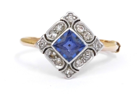 An Art Deco sapphire and diamond ring, in a cushion shaped setting, in yellow and white metal, stamped plat and 18ct, size N, 2.5g.