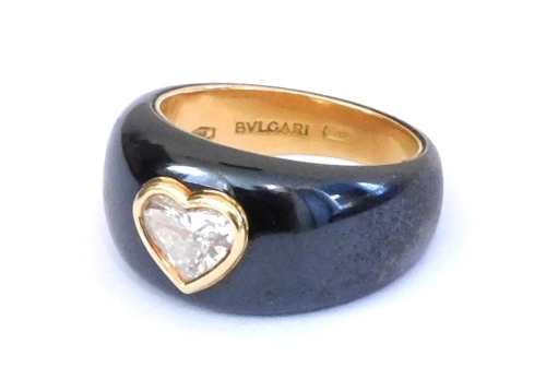 A Bulgari 18ct gold diamond and black enamel ring, set with a heart shaped diamond, size K/L, 9.4g, together with a Chopard of Geneve box.