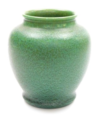 A Pilkington Royal Lancastrian pottery vase, of circular form with a flared rim, mottle green glaze, impressed marks and numbered 3271, 17cm high.