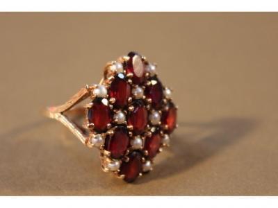 A 9ct garnet and pearl cluster ring