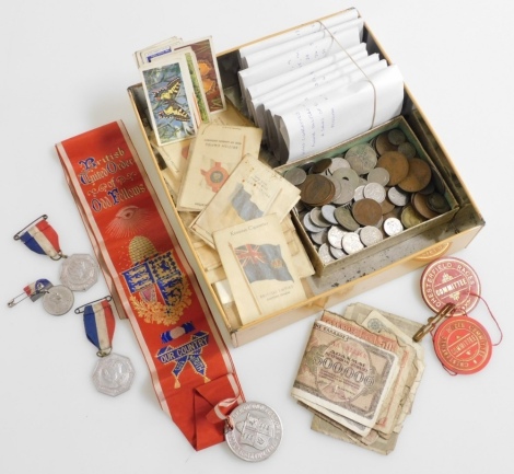 A group of cigarette cards, pre decimal and world coinage, to include one pennies, Indian rupee, various sixpences, post 1946, world banknotes, a British United Order of Odd Fellows medallion and ribbon, two Chesterfield Races Committee badges, two King G