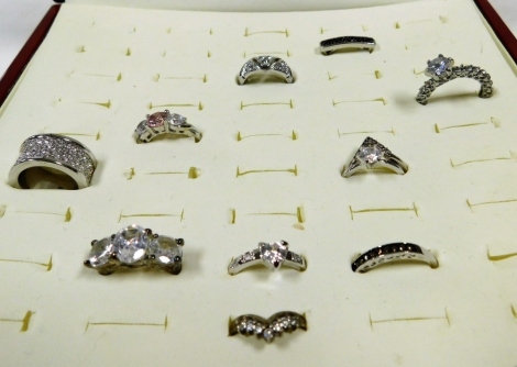 A group of paste set dress rings, various styles, contained in a wooden ring box. (10)