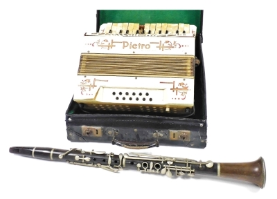 A Pietro piano accordion, stamped Made in Germany, one key missing, 35cm wide, in case, and a Hawks and Son Excelsior Sonorous clarinet. (2)