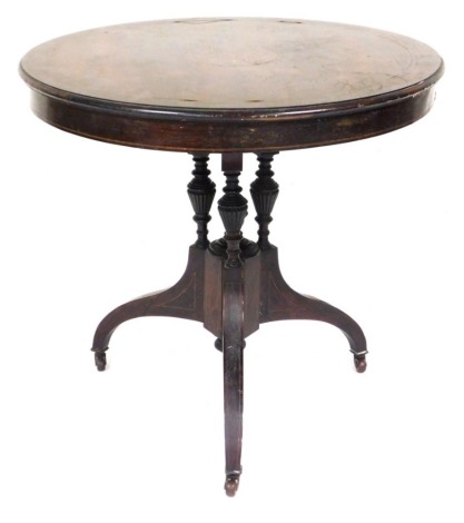 A Victorian rosewood and marquetry occasional table, the circular top with moulded edge, on three turned and fluted supports, with down swept legs, on castors, 68cm high, 73cm wide.