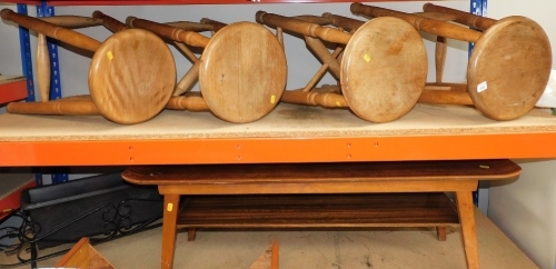 A set of four oak bar stools, a mid century two tier coffee table, and a wrought iron garden planter. Lots 1501 to 1564 are available to view and collect at our additional premises SALEROOM NINE, Unit 9 Chandlers Yard, Grantham, NG31 6PG. For more detail