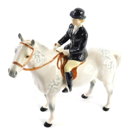 A Beswick black jacketed huntswoman, grey colourway, printed marks beneath, 24cm high.