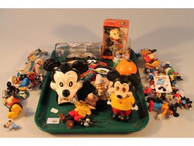 A collection of Disney related toys including Mickey Mouse figures