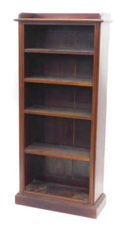 A mahogany open bookcase, with a raised gallery above four adjustable shelves, on a plinth, 159cm high, 72cm wide.