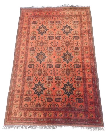 A Persian rug, with an all over design of medallions, scrolls, geometric devices within four narrow borders, 194cm x 127cm.