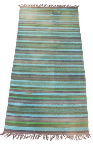 A Kilim rug, with striped design, in turquoise, green, navy, etc., 203cm x 103cm.