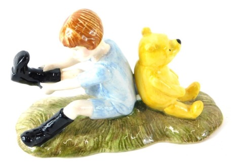 A Royal Doulton Winnie the Pooh collection Christopher Robin and Pooh figure, WP10, printed marks beneath.