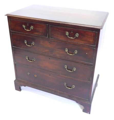 A George III mahogany chest of drawers, the top with a moulded edge above two short and three long drawers with bracket feet, 86cm high, 96cm wide.