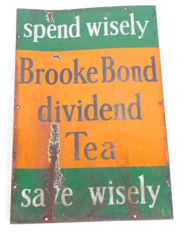 A Brooke Bond Tea enamel sign, the Brooke Bond Dividend Tea, Spend Wisely, on an orange and green enamel ground, 76cm x 51cm. (AF)