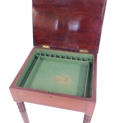 An early 19thC mahogany work table, with rectangular figured top and rosewood cross banded decoration on reeded and tapered legs, with a green fitted interior, 76cm high, 49cm wide, 42cm deep. - 2