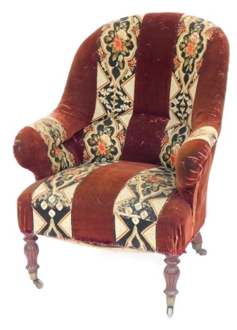 A 19thC armchair, with floral striped woolwork on turned and reeded mahogany legs, 96cm high, 71cm wide, 60cm deep.