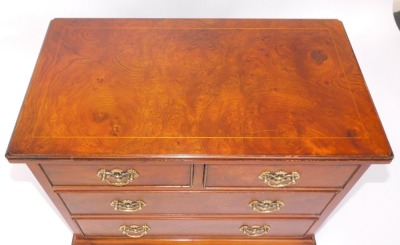 A walnut chest of drawers, two short and two long drawers, with brass handles on bracket feet, 60cm high, 66cm wide, 35cm deep. - 3