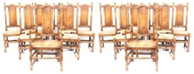 A set of fourteen oak dining chairs, each with an oval back on bobbin turned supports, comprising two carvers.