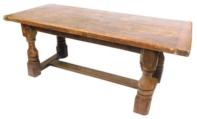 An oak refectory table, with planked top on H frame base, 76cm high, 194cm wide, 88cm deep.