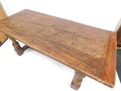 An oak refectory table, with planked top on H frame base, 76cm high, 194cm wide, 88cm deep. - 2