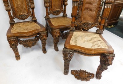 A set of four hardwood carved Carolean style highback chairs, each with a moulded crest and cane rush seat, on out scrolled legs, 156cm high. (AF) - 3