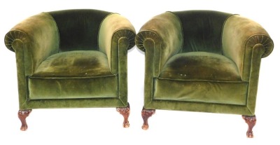 A pair of late 19thC tub chairs, each with rolled arms on mahogany carved legs, 76cm high, 90cm wide, 76cm deep.