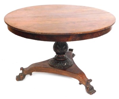 A 19thC mahogany dining table, the circular top on tripod base with acorn finial column, on claw feet, 77cm high, 114cm diameter. (AF)