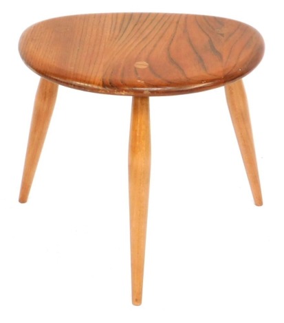 An Ercol pebble shaped elm table, from a nest, unmarked, 32cm high, 34cm wide.