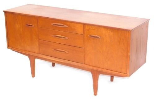 A teak sideboard, with arrangement of two doors and three drawers, on tapered legs, 73cm high, 151cm wide, 45cm deep.