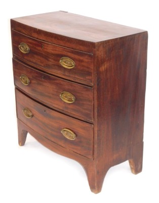 A 19thC bowfront chest, with three drawers, with brass oval and back plates and swing handles, bracket feet, 82.5cm high, 75cm wide, 37cm deep.