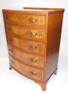 A George III style mahogany bow front chest, of five graduated drawers, with cross banded top, brass loop handles and bracket feet, 118cm high, 85cm wide, 56cm deep,