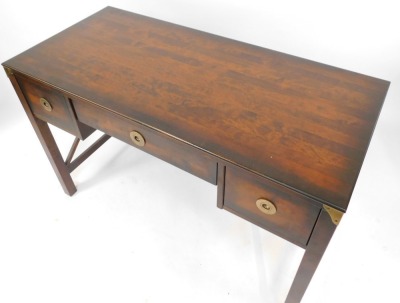 A hardwood writing desk or dressing table, with an arrangement of two drawers with circular brass handles, on X framed supports, 78cm high, 120cm wide, 56cm deep, retailed by Laura Ashley. - 2