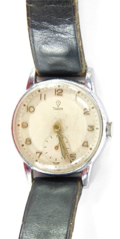 A Tudor gent's wristwatch, on a white dial with gold numeric outer dial and seconds counter in a chrome case on a black leather strap, 3cm diameter.