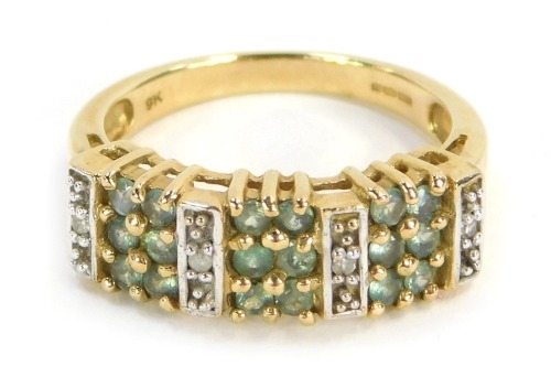 A peridot and CZ set dress ring, of three panelled design, yellow metal, stamped 9k, ring size N½, 3.8g all in.