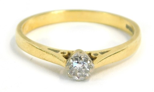 An 18ct gold diamond solitaire ring, with round brilliant cut diamond in claw setting, approx 0.10cts, on a pierced shank, ring size P½, 2.8g all in.