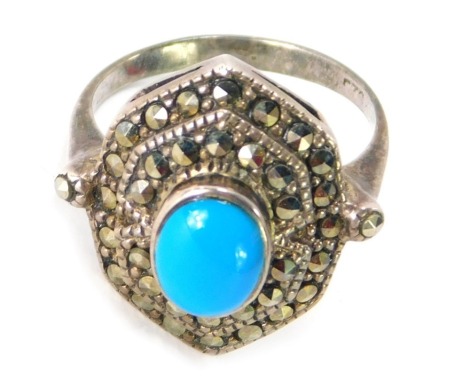 A silver, marcasite and turquoise set dress ring, in the Art Deco style with central turquoise on two outer fanned marcasite set border, ring size O, 5.2g all in.