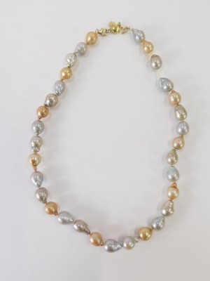 A pearl necklace, with multi coloured natural pearl links, in a cream, orange and grey overall lustre, the beads approximately 1.5cm high on a yellow metal clasp with expansion clasp, stamped 10kt, 53.8g all in. - 2