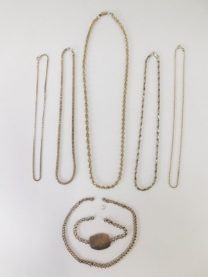 A group of silver chains, to include a modern wave design silver chain, 60cm long a multi-link twist design chain, 44cm long, a Figaro type chain, 44cm long and two curb lined chains, 40cm long and 44cm long, together with a silver identity bracelet for F - 5