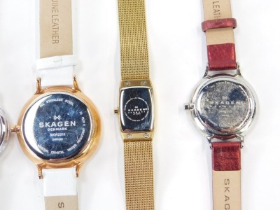 A group of lady's wristwatches, to include a Skagen chronograph on white leather strap, a Skagen stainless and red material strapped bracelet, a Skagen gold plated and mother of pearl dial wristwatch, an Aurora lady's wristwatch and a Paulo Fude wristwatc - 6